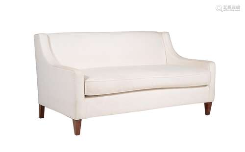 A cream upholstered two seater sofa