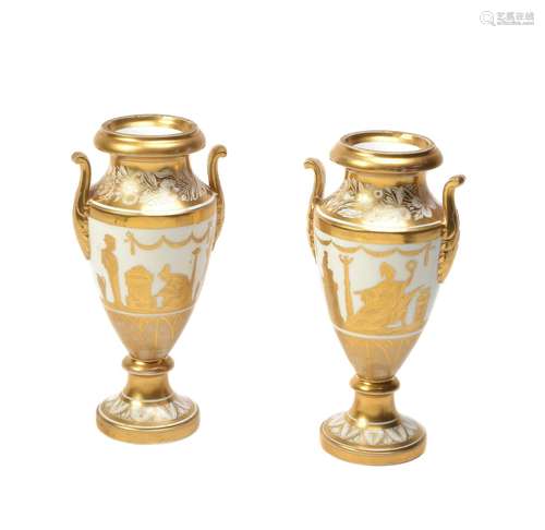 A pair of Paris porcelain two-handled vases decorated by Manteau