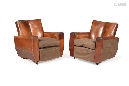 A pair of brown leather upholstered armchairs