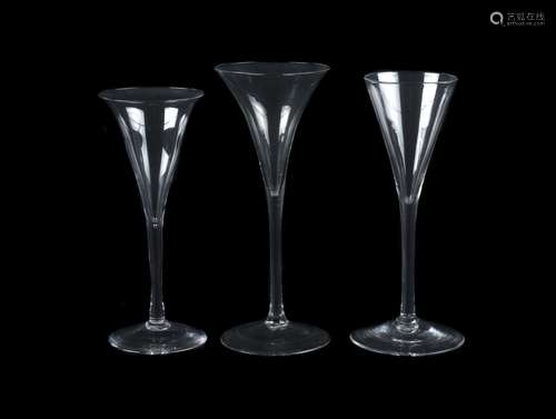 Three plain stemmed toasting glasses of drum trumpet form