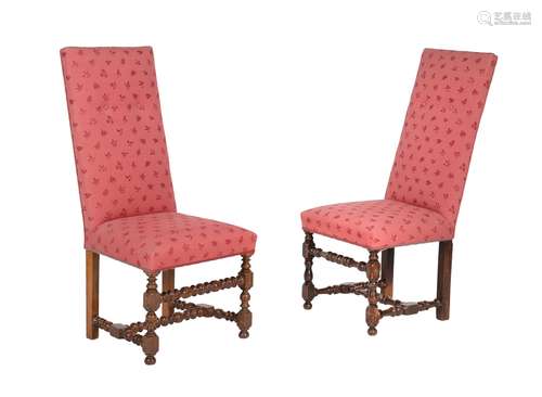 A set of eight walnut and upholstered dining chairs