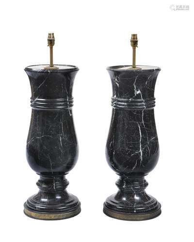 A pair of substantial black and white veined marble and gilt metal mounted table lamps