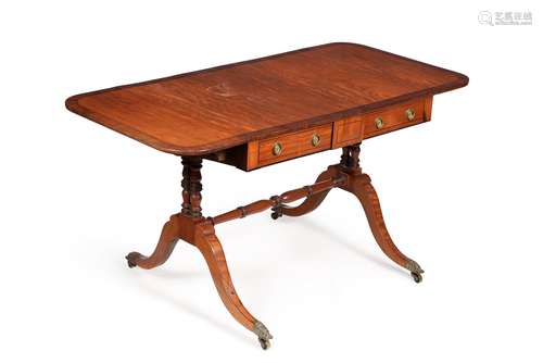 A Regency satinwood and mahogany crossbanded sofa table