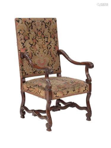 A walnut and tapestry upholstered armchair