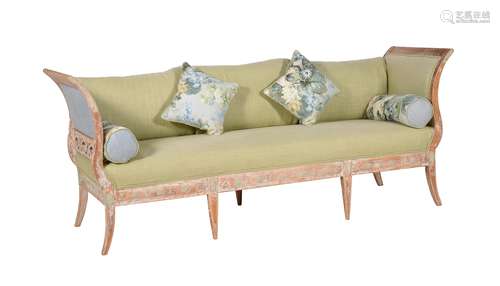 A distressed pine, composition and upholstered sofa