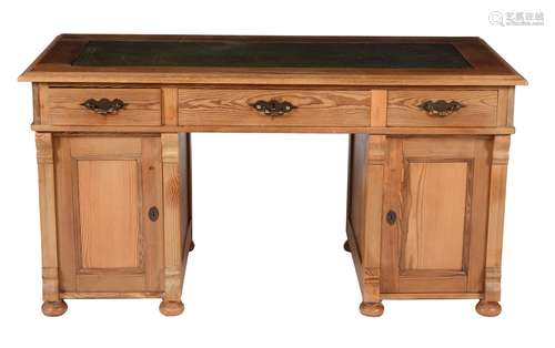 A pine pedestal desk