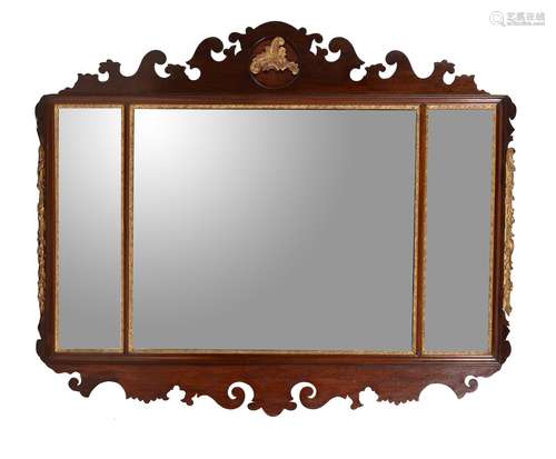 A mahogany and parcel gilt fretwork wall mirror in George II style