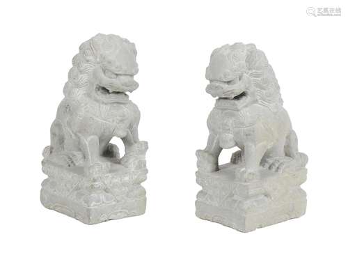 A pair of carved stone garden ornaments