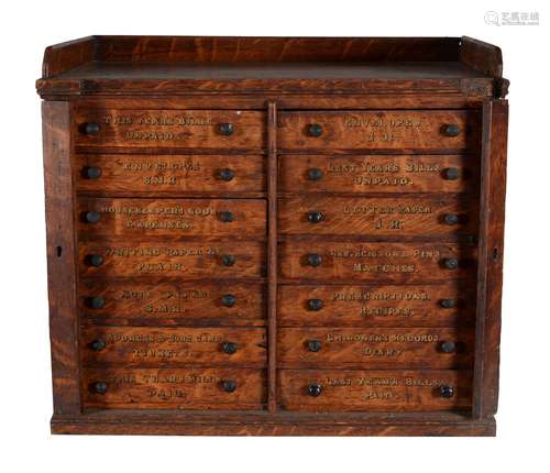 An Edwardian oak 'housekeeper's' Wellington chest