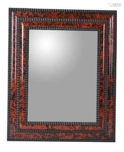 A faux tortoiseshell veneered wall mirror in 17th century style