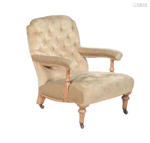 A late Victorian stripped walnut and upholstered low armchair