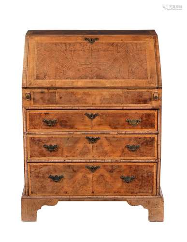 A walnut and feather banded bureau