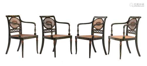 A set of four green painted elbow chairs in Regency style