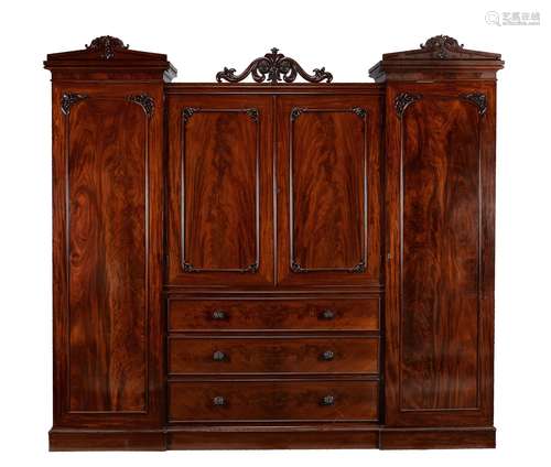 A William IV flame mahogany compactum wardrobe