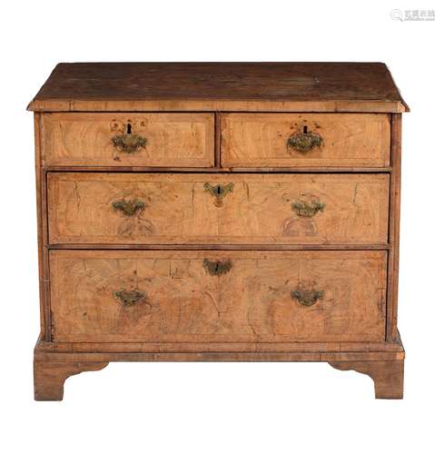 A walnut and feather banded chest of drawers