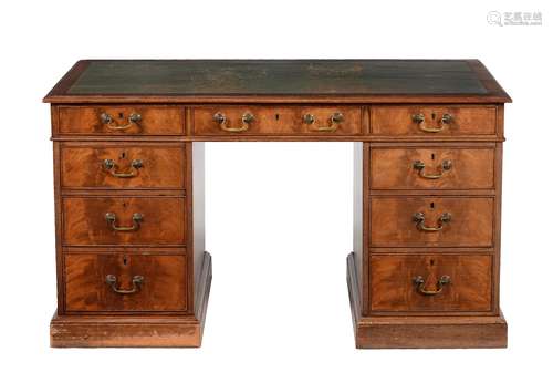 A mahogany and leather inset pedestal desk in George III style