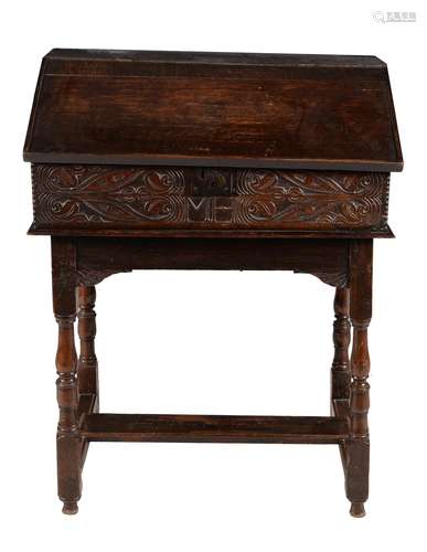 A carved oak bible box on stand