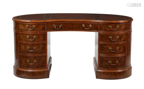 A walnut pedestal desk in Victorian style