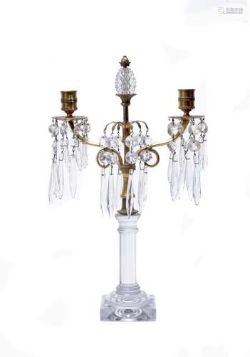 A Regency cut and moulded glass and gilt metal mounted twin light lustre candelabrum