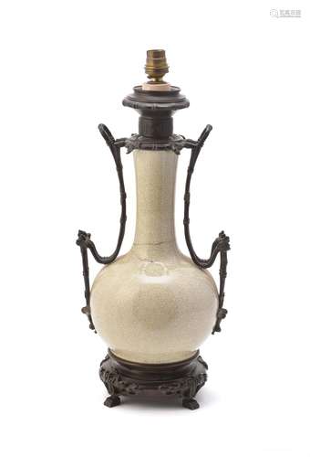 A Chinese white crackle-glazed gilt-bronze mounted lamp