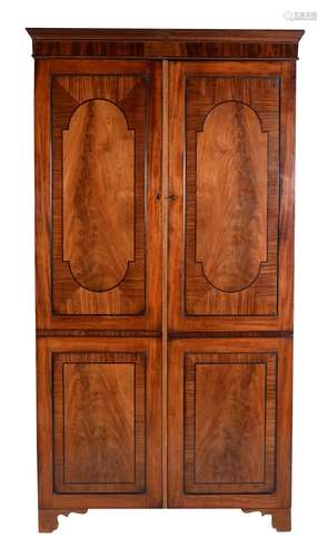 A Regency mahogany and ebonised inlaid wardrobe