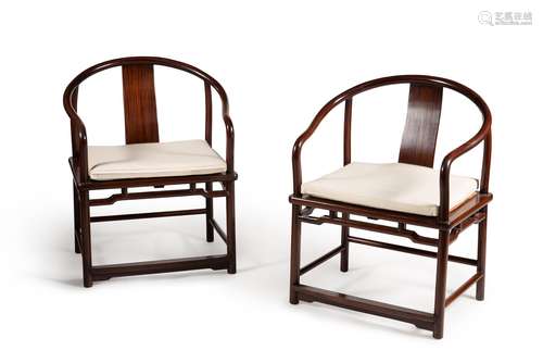 A pair of Chinese hardwood armchairs