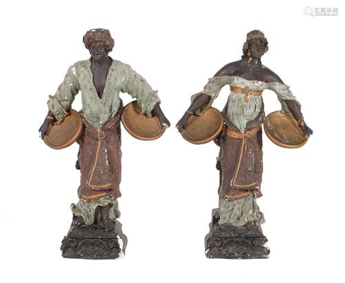 A pair of painted plaster models of Blackamoor figures