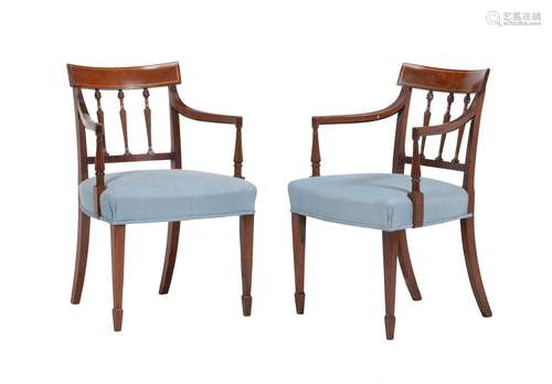 A pair of George III mahogany elbow chairs