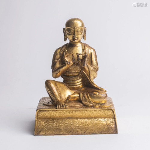 Tibetan Gilt Bronze Buddha Seated on Sealed Pill…