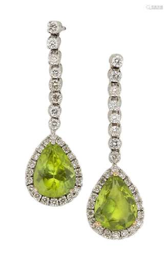 A pair of 18ct. gold, peridot and diamond earrings, each with a triangular-shaped peridot single