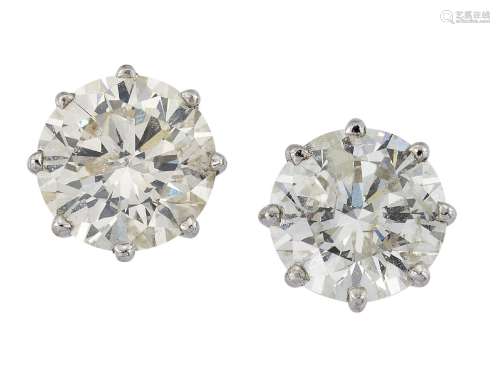 A pair of diamond single stone earstuds, the brilliant-cut diamonds in claw mountsPlease refer to