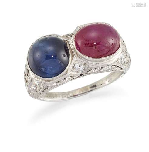 A ruby, sapphire and diamond ring, composed of an oval ruby cabochon and a circular sapphire