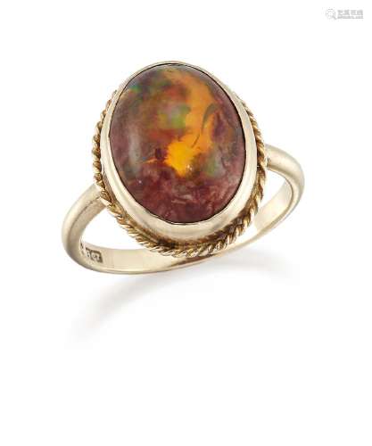 A Mexican fire opal single stone ring, the single cabochon opal in collet-setting with ropework