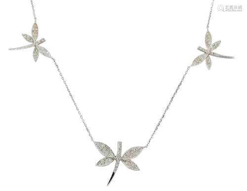 An 18ct white gold and diamond dragonfly necklace, the three pave set diamond dragonflies