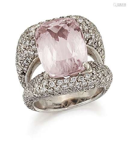 A kunzite and diamond ring, the cushion shaped kunzite mounted within pavé brilliant-cut diamond