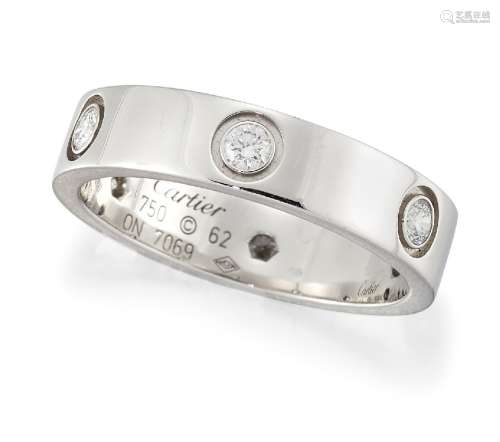 An 18ct white gold, diamond-set 'Love' ring by Cartier, the band set at intervals with brilliant-cut
