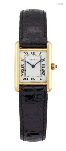 An 18ct gold 'Tank' quartz wristwatch by Cartier, the rectangular white dial with Roman numerals and