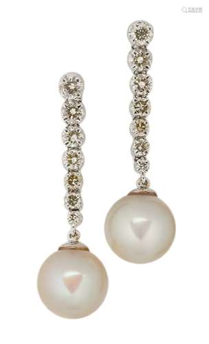 A pair of 18ct. gold, cultured pearl and diamond earrings, each with single cultured pearl drop,