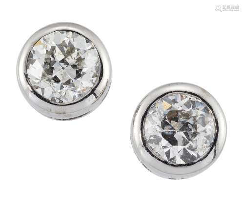 A pair of diamond earstuds, the brilliant-cut diamonds in collet mounts, approximate spread of
