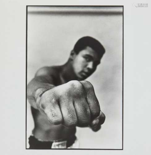 Thomas Hoepker, German b.1936- Muhammad Ali, boxing world heavyweight champion showing off his right