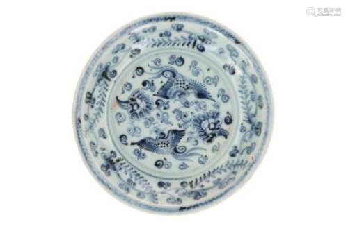 A blue and white porcelain deep dish, decorated with two phoenixes among flowering plants. Unmarked.