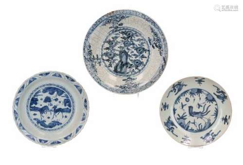 Lot of three blue and white Swatow porcelain chargers, decorated with flowers and animals. One