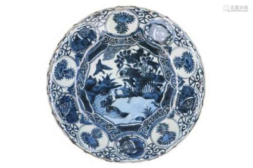 A blue and white 'kraak' porcelain deep charger, decorated with birds, flowers, fruits and