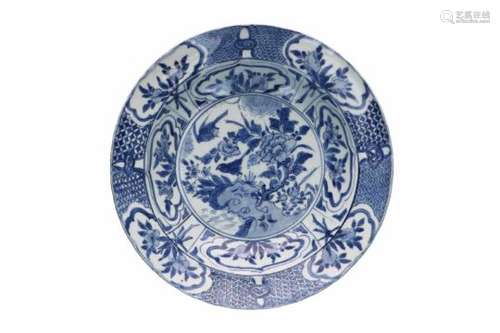 A blue and white 'kraak' porcelain deep dish, decorated with flowers, fruits and birds. Unmarked.