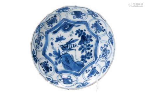A blue and white 'kraak' porcelain dish, decorated with flowers, a butterfly and a cricket.