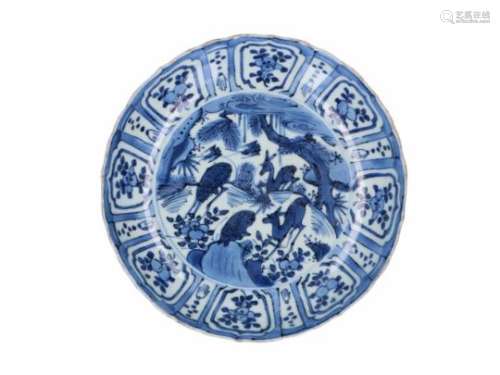 A blue and white 'kraak' porcelain deep dish, decorated with deer, birds and flowers. Unmarked.