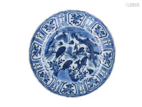 A blue and white 'kraak' porcelain deep dish, decorated with deer, birds and flowers. Unmarked.