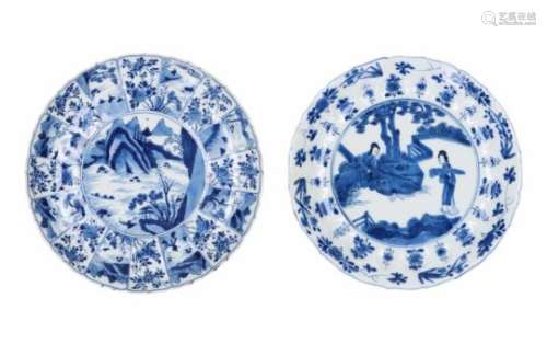 A blue and white porcelain dish with scalloped rim, decorated with ladies in a garden and flowers.