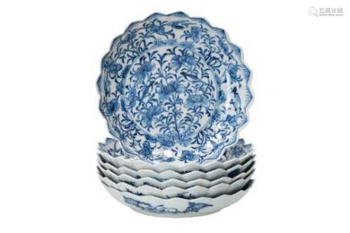 A set of six blue and white porcelain deep saucers with scalloped rim, decorated with flowers and