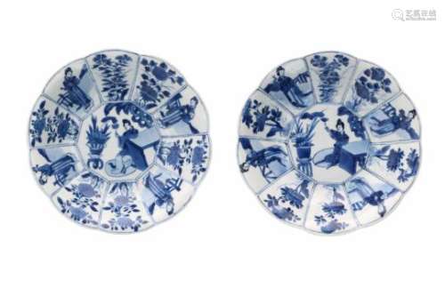 A pair of lobed blue and white porcelain deep dishes with scalloped rim, decorated with long